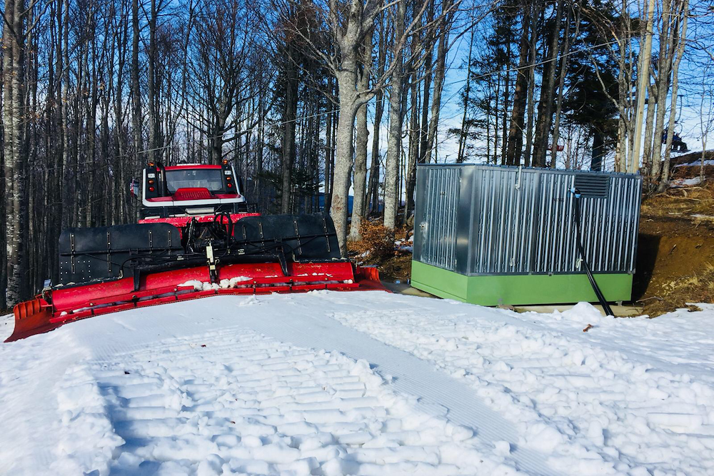 Enclosed aboveground fuel storage unit at a mountain operations site