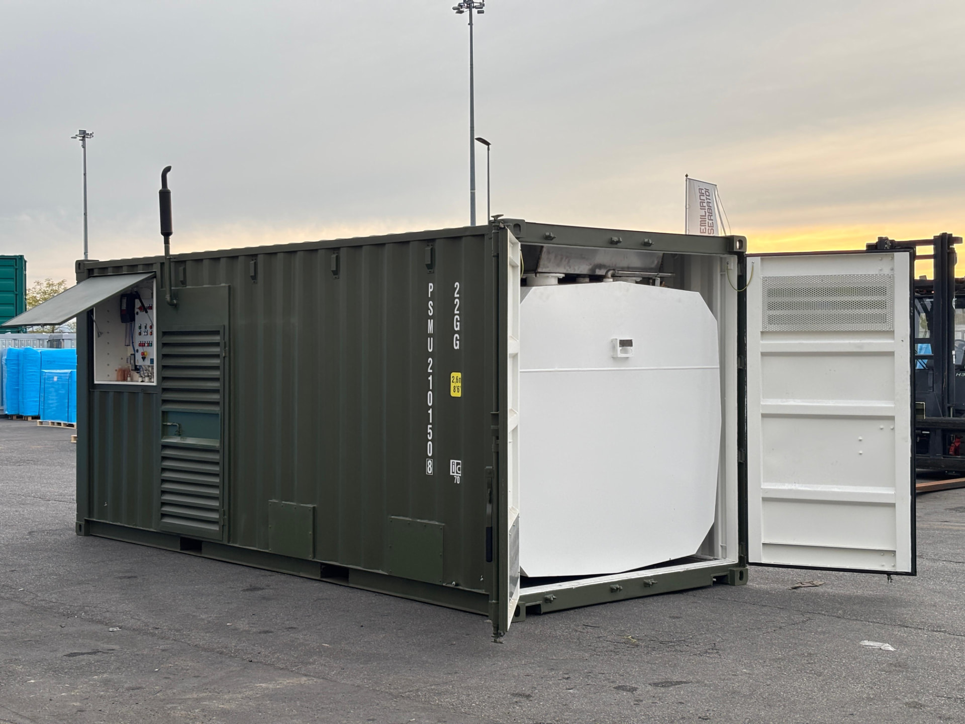 Containerized fuel farm opened to show the internal storage tank and control panel