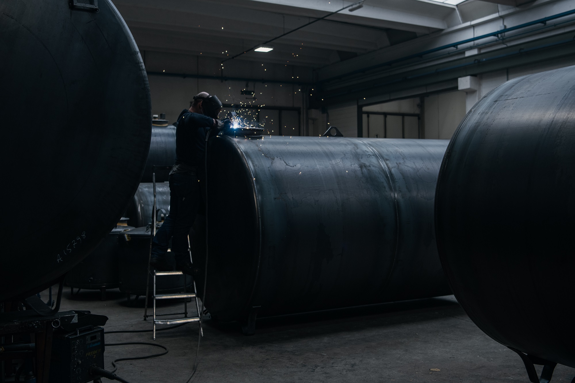 Aboveground and underground fuel storage tanks installed at a commercial site