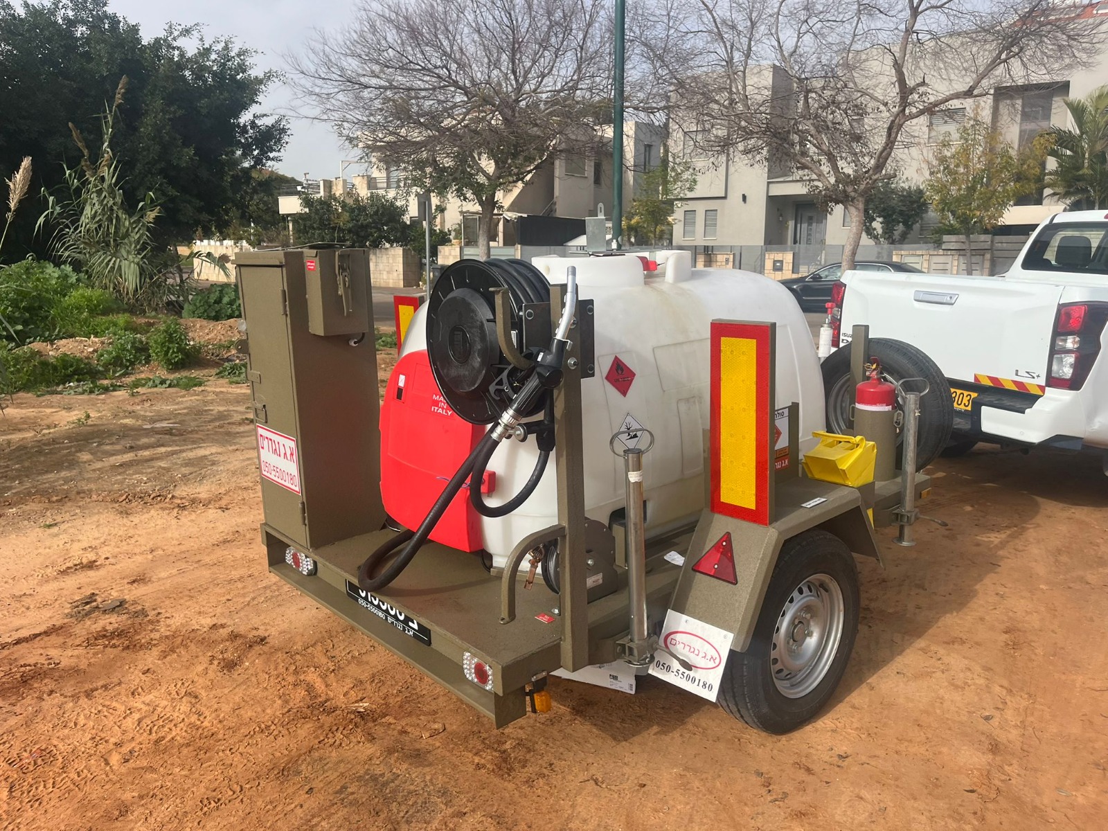 Trailer-mounted transportable fuel dispensing unit hitched to a pickup truck