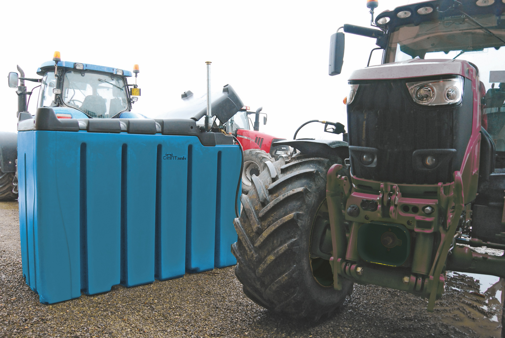 Blue bunded DEF storage tank in service alongside agricultural tractors
