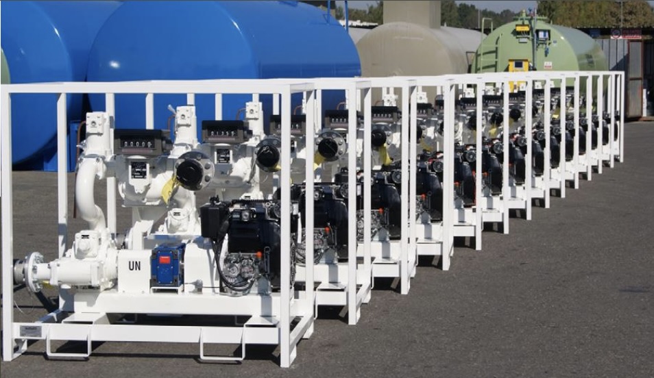 Row of UN-marked fuel transfer skids staged in the yard