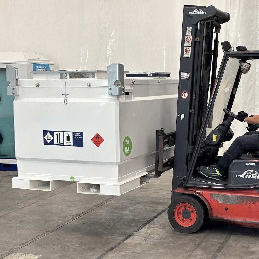 White TankCube being moved by forklift in a warehouse